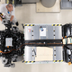EV battery pack and motors in a factory